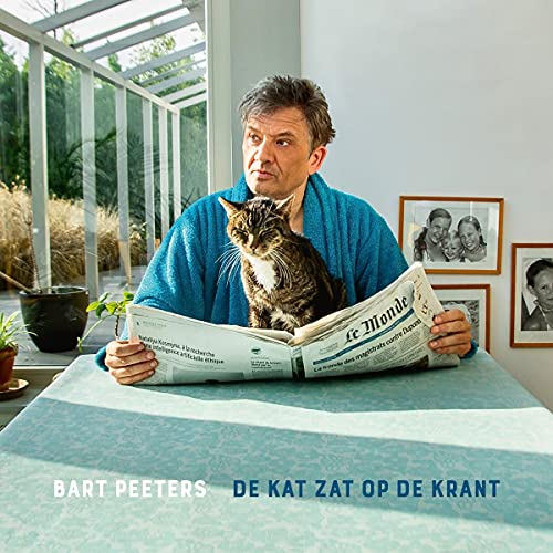 De Kat Zat Op De Krant