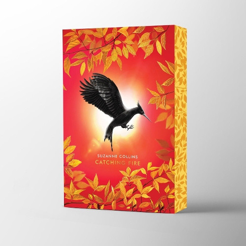 Catching Fire Deluxe (Hunger Games The) by Suzanne Collins