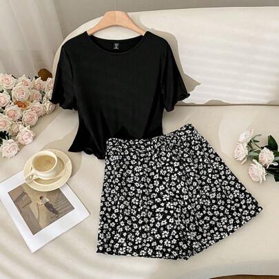 Set coordinato estivo per taglie forti: Top nero a costine e gonna stampata con margherite, completo da donna a 2 pezzi