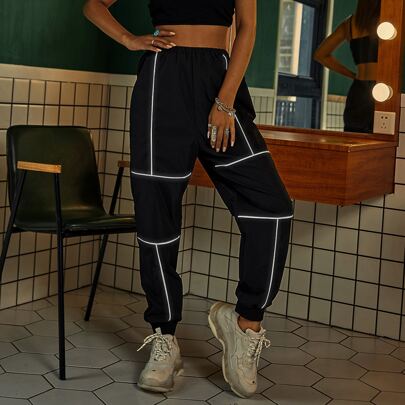 Pantaloni sportivi piping contrasto catarifrangente