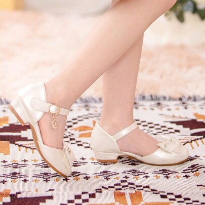 Sandali eleganti per bambini con fiocco color champagne e tacco alto in stile principessa, oggetto richiesto in color champagne per le ragazze della f