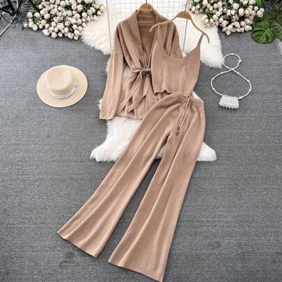 3-Piece Beige Lounge Set – Cardigan, Cami Top & Flared Pants | Beige 3-piece lounge set with cardigan, camisole top, and wide-leg pants laid flat with