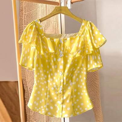 Blusa casual oversize con pois gialli e balze