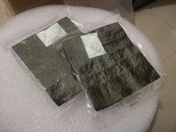 10.25 Nuova Vendita Calda Di Alta Qualità 50-100 Pezzi Sushi Nori Fogli Laver Essiccato Per Sushi Set All'Ingrosso Aaa Nori Sushi Factory