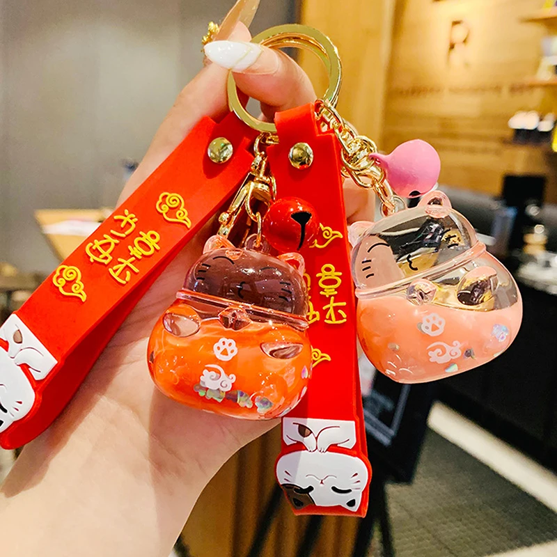 Carino Maneki Neko Lucky Cat Liquid Crystal Quicksand Rubber Wristband Portachiavi Portachiavi Per Ciondoli Borsa Da Donna