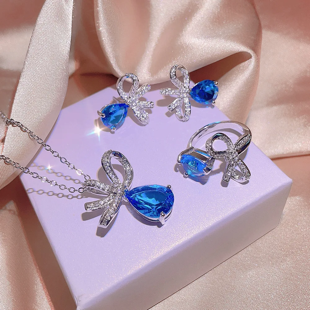 925 Gioielli Stampati Trio Fashion Teardrop Blue Zirconia Ring Orecchini Collana A Forma Di Fiocco Regalo Di Gioielli Per Feste
